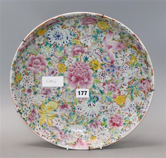 A Chinese famille rose thousand flower pattern dish, Republic period with Qianlong mark, diameter 33cm (a.f.)